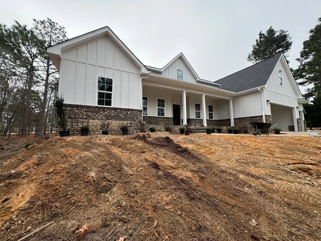 Newly built home with fresh landscaping by Gamez Landscaping
